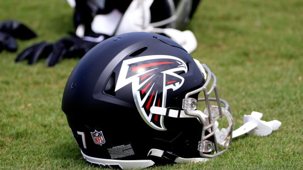 FLOWERY BRANCH, GA - JULY 30: A Falcons helmet on the field during Saturday morning workouts for the Atlanta Falcons on July, 30, 2022 at the Atlanta Falcons Training Facility in Flowery Branch, Georgia.  (Photo by David J. Griffin/Icon Sportswire via Getty Images)