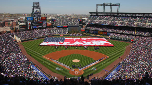 DENVER, CO - APRIL 09:  The American Flag is displayed on the field as the national anthem is observed prior to the game between the San Francisco Giants and the Colorado Rockies on Opening Day at Coors Field on April 9, 2012 in Denver, Colorado.  (Photo by Doug Pensinger/Getty Images)