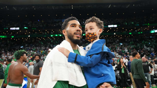 BOSTON, MA - MAY 15: Jayson Tatum #0 of the Boston Celtics and his son, Deuce Tatum, seen after Game 7 of the 2022 NBA Playoffs Eastern Conference Semifinals on May 15, 2022 at TD Garden in Boston, Massachusets. NOTE TO USER: User expressly acknowledges and agrees that, by downloading and/or using this Photograph, user is consenting to the terms and conditions of the Getty Images License Agreement. Mandatory Copyright Notice: Copyright 2022 NBAE (Photo by Jesse D. Garrabrant/NBAE via Getty Images)