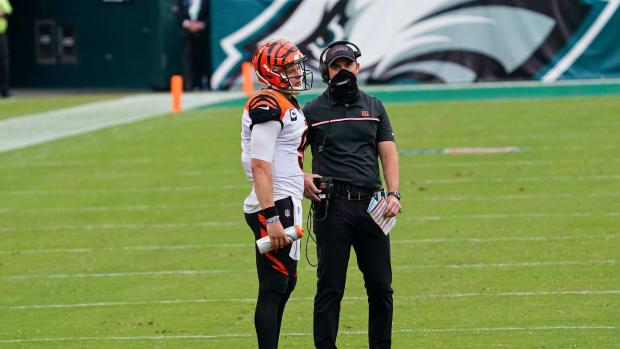 PHILADELPHIA, PA - SEPTEMBER 27: Cincinnati Bengals quarterback Joe Burrow (9) and Cincinnati Bengals head coach Zac Taylor discuss a play during the game between the Cincinnati Bengals and the Philadelphia Eagles on September 27, 2020 at Lincoln Financial Field in Philadelphia, PA.  (Photo by Andy Lewis/Icon Sportswire via Getty Images)