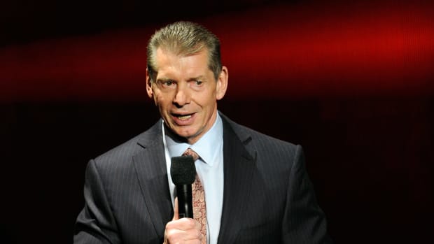 WWE Chairman and CEO Vince McMahon speaks at a news conference.