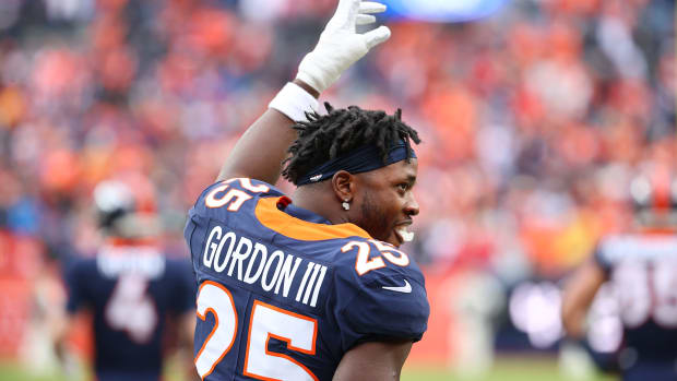 DENVER, COLORADO - JANUARY 08: Melvin Gordon #25 of the Denver Broncos gestures prior to facing the Kansas City Chiefs at Empower Field At Mile High on January 08, 2022 in Denver, Colorado. (Photo by Jamie Schwaberow/Getty Images)