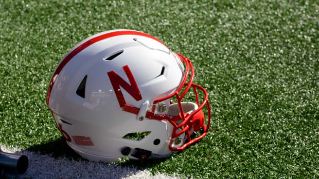 A Nebraska Cornhuskers helmet rests on the field during a 52-17 win over the Wyoming Cowboys.