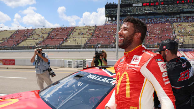 BROOKLYN, MICHIGAN - AUGUST 06: Bubba Wallace, driver of the #23 McDonald's Toyota, celebrates after winning the pole award for the NASCAR Cup Series FireKeepers Casino 400 at Michigan International Speedway on August 06, 2022 in Brooklyn, Michigan. (Photo by Mike Mulholland/Getty Images)