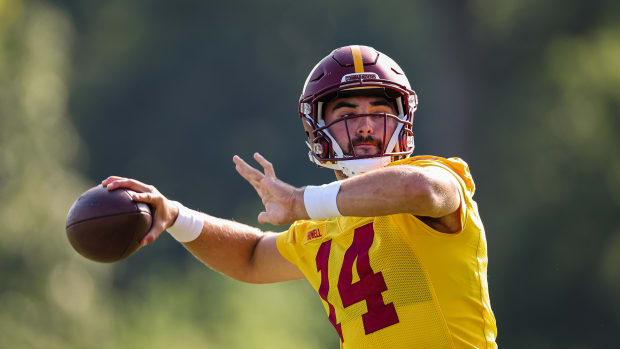 ASHBURN, VA - AUGUST 10: Sam Howell #14 of the Washington Commanders attempts a pass during training camp at INOVA Sports Performance Center on August 10, 2022 in Ashburn, Virginia. (Photo by Scott Taetsch/Getty Images)