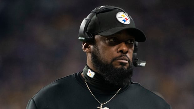 Steelers head coach Mike Tomlin stands on the sideline.