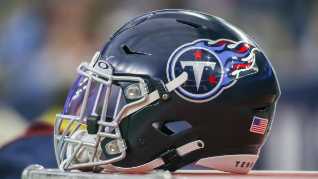 Tennessee Titans helmet rests on equipment trunk.
