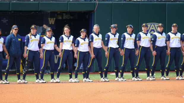 A photo of the Michigan softball team lined up before a game.