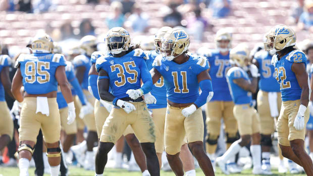 The UCLA Bruins celebrate after sacking Jamie Sheriff of South Alabama after Sheriff faked a field goal attempt late in the fourth quarter.