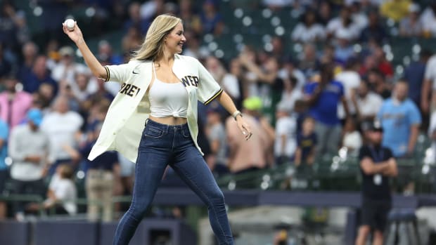 Paige Spiranac throws out the first pitch during a Milwaukee Brewers game.