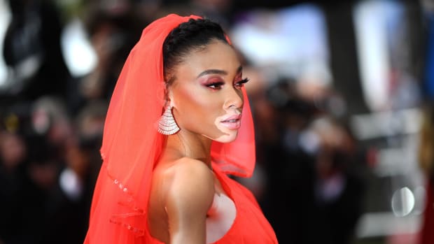 Winnie Harlow posing on the red carpet at a film festival in 2019.