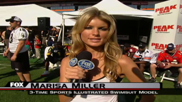 Marisa Miller reporting for Fox Sports at a football event.