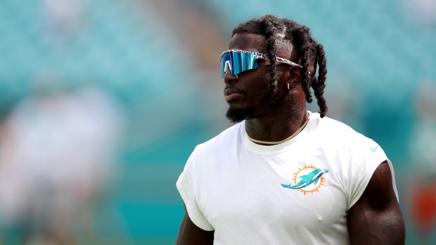 Tyreek Hill of the Miami Dolphins warms up before a game against the New England Patriots.
