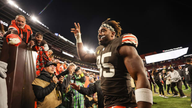 Myles Garrett waves to Browns fans while leaving the field in Cleveland.