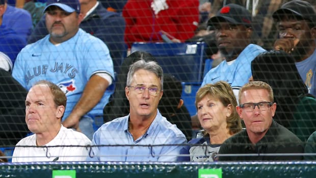 Roger Maris Jr. sits in the stands with Aaron Judge's mother.