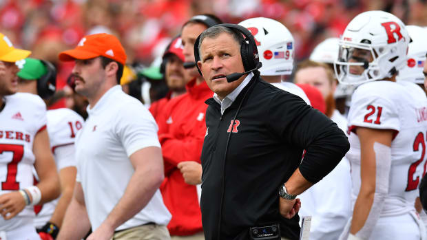 Rutgers head Coach Greg Schiano watches a replay against the Ohio State Buckeyes.