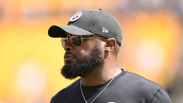 Steelers head coach Mike Tomlin watches warm ups before a game against the New England Patriots.