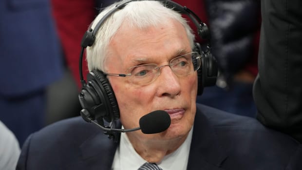 ESPN analyst Hubie Brown looks on during a game between the Denver Nuggets and Philadelphia 76ers in 2022.