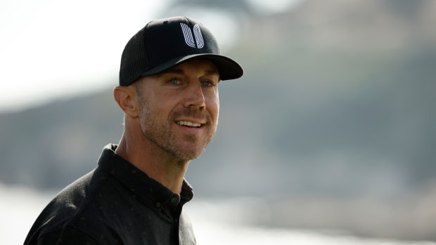 PEBBLE BEACH, CALIFORNIA - FEBRUARY 05: Former 49ers quarterback Alex Smith reacts on the 18th hole during the third round of the AT&T Pebble Beach Pro-Am at Pebble Beach Golf Links on February 05, 2022 in Pebble Beach, California. (Photo by Cliff Hawkins/Getty Images)
