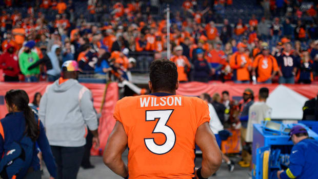 Russell Wilson walking off the field in Denver.
