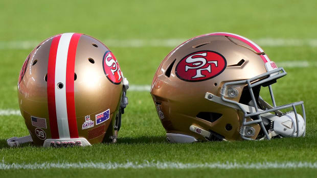 San Francisco 49ers helmets sitting on the field prior to the start of a game against the Rams at Levi's Stadium.