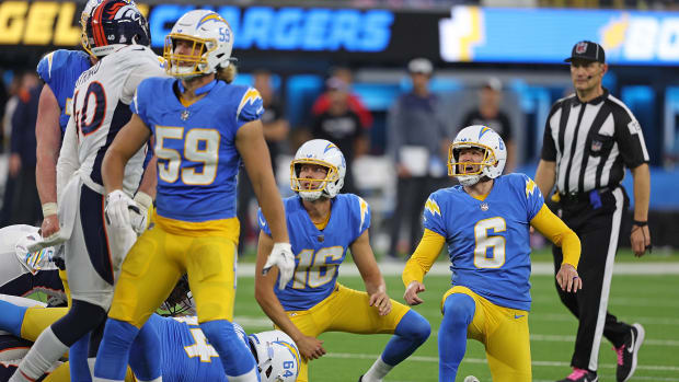 Dustin Hopkins goes to a knee after making a field goal for the Chargers.