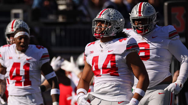 J.T. Tuimoloau celebrates against Penn State.