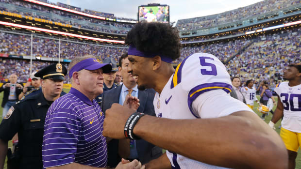 Head coach Brian Kelly and Jayden Daniels #5 of the LSU Tigers (Photo by Jonathan Bachman/Getty Images)