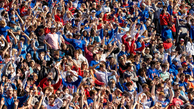 LAWRENCE, KS - NOVEMBER 05:  Kansas fans wave the wheat in celebration during the Big 12 regular season matchup between the Kansas Jayhawks and the Oklahoma State Cowboys on Saturday, November 5, 2022 at Memorial Stadium in Lawrence, KS.  (Photo by Nick Tre. Smith/Icon Sportswire via Getty Images)