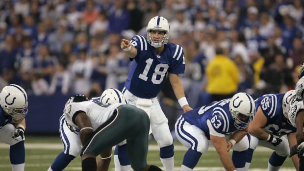 INDIANAPOLIS - NOVEMBER 26:  Peyton Manning #18 of the Indianapolis Colts gestures at the line of scrimmage behind center Jeff Saturday #63 against the Philadelphia Eagles November 26, 2006 at the RCA Dome in Indianapolis, Indiana. The Colts won 45-21. (Photo by Jonathan Daniel/Getty Images)