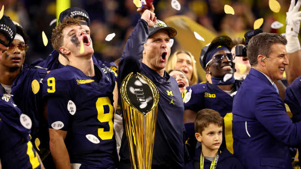 J.J. McCarthy and Head Coach Jim Harbaugh of the Michigan Wolverines