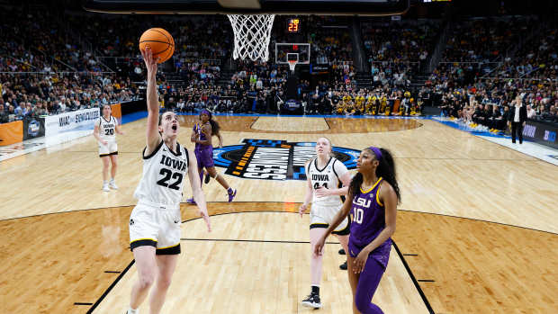 ALBANY, NEW YORK - APRIL 01: Caitlin Clark #22 of the Iowa Hawkeyes shoots the ball over Angel Reese #10 of the LSU Tigers during the first half in the Elite 8 round of the NCAA Women's Basketball Tournament at MVP Arena on April 01, 2024 in Albany, New York. (Photo by Sarah Stier/Getty Images)