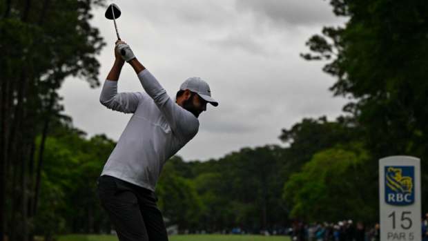 HILTON HEAD ISLAND, SOUTH CAROLINA - APRIL 21:  Scottie Scheffler plays his shot from the 15th hole tee following a weather delay in the final round of the RBC Heritage at Harbour Town Golf Links on April 21, 2024 in Hilton Head Island, South Carolina. (Photo by Keyur Khamar/PGA TOUR via Getty Images)