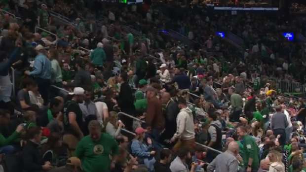 Celtics fans leave a game with five minutes left.