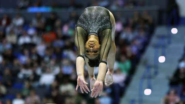 Gymnast Konnor McClain on the balance beam.