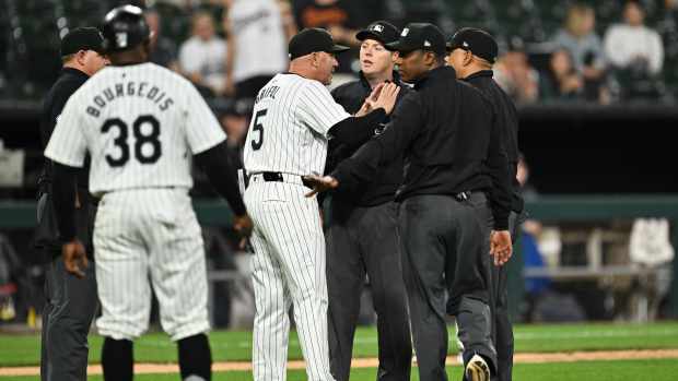 CHICAGO, IL - MAY 23: Manager Pedro Grifol #5 of the Chicago White Sox talks with umpires after baserunner Andrew Vaughn #25 was called out for interference ending the game against the Baltimore Orioles at Guaranteed Rate Field on May 23, 2024 in Chicago, Illinois. Baltimore defeated Chicago 8-6. (Photo by Jamie Sabau/Getty Images)