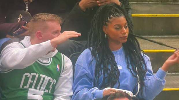 Taylor Rooks and a Celtics fan.