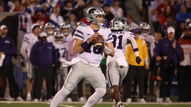 Kansas State quarterback Will Howard steps back to throw a pass.