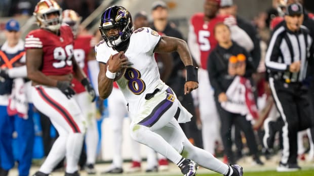 SANTA CLARA, CALIFORNIA - DECEMBER 25: Lamar Jackson #8 of the Baltimore Ravens runs the ball during the second quarter against the San Francisco 49ers at Levi's Stadium on December 25, 2023 in Santa Clara, California. (Photo by Thearon W. Henderson/Getty Images)
