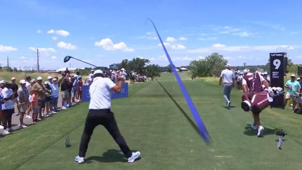 Brooks Koepka strikes a tee marker at LIV Dallas.