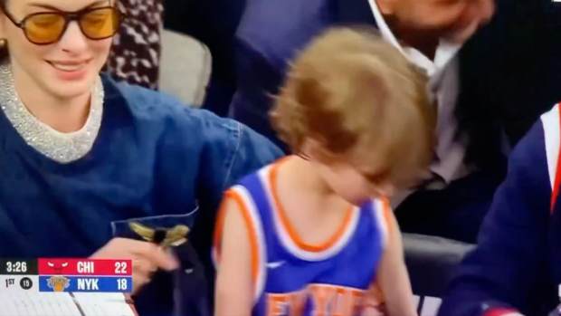 Anne Hathaway at a Knicks game.