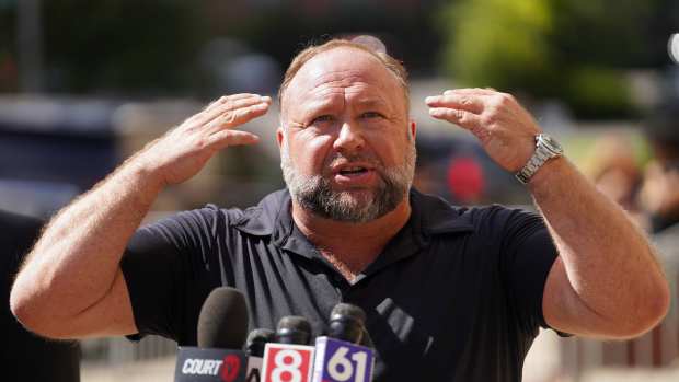 WATERBURY, CONNECTICUT - SEPTEMBER 21: InfoWars founder Alex Jones speaks to the media outside Waterbury Superior Court during his trial on September 21, 2022 in Waterbury, Connecticut. Jones is being sued by several victims' families for causing emotional and psychological harm after they lost their children in the Sandy Hook massacre. A Texas jury last month ordered Jones to pay $49.3 million to the parents of 6-year-old Jesse Lewis, one of 26 students and teachers killed in the shooting in Newtown, Connecticut. (Photo by Joe Buglewicz/Getty Images)