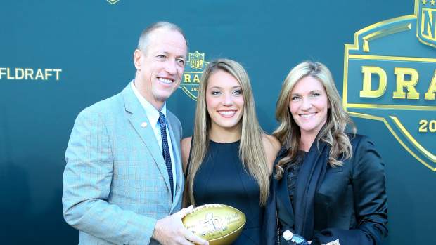 30 APR 2015: NFL Hall of Famer and Buffalo Bill Quarterback Jim Kelly and his wife Jill and daughter Erin carries a Gold Football on the Gold Carpet at the 2015 National Football League Draft. The 2015 National Football League Draft was held at the Auditorium Theatre in Chicago IL. (Photo by Rich Graessle/Icon Sportswire/Corbis/Icon Sportswire via Getty Images)