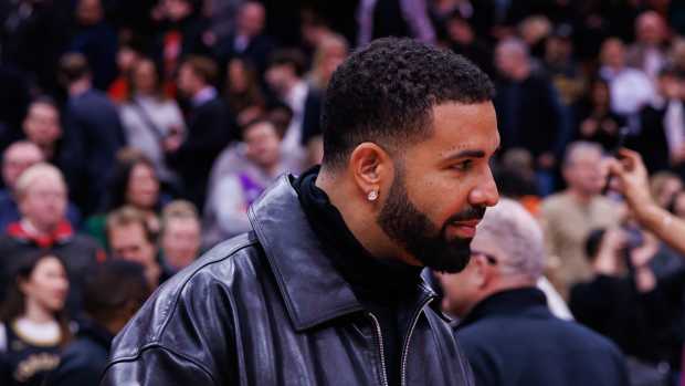 Drake courtside at an NBA game.