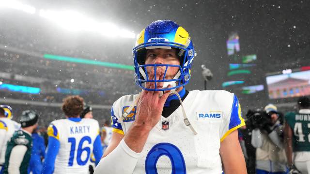 Matthew Stafford walks off the field after the Los Angeles Rams' playoff loss to the Philadelphia Eagles.