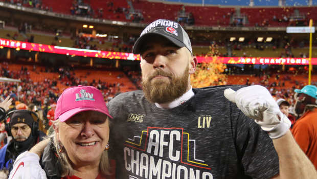 Travis Kelce poses with his mother after winning the AFC Championship in 2020.