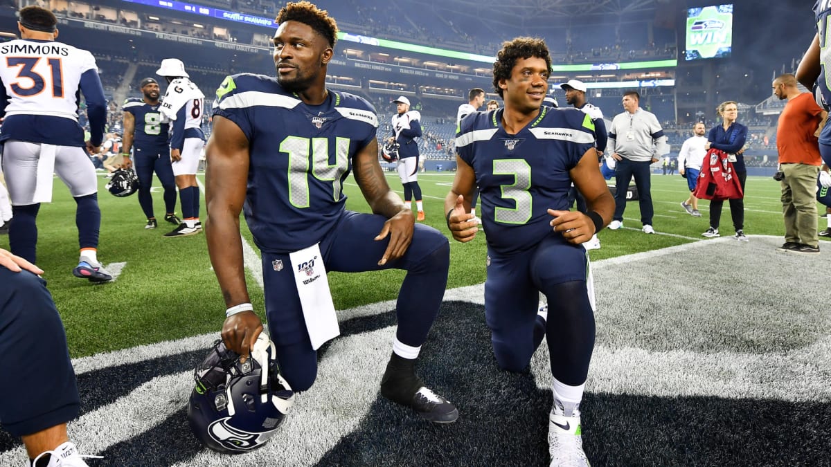 DK Metcalf of the Seattle Seahawks reacts after diving to make a