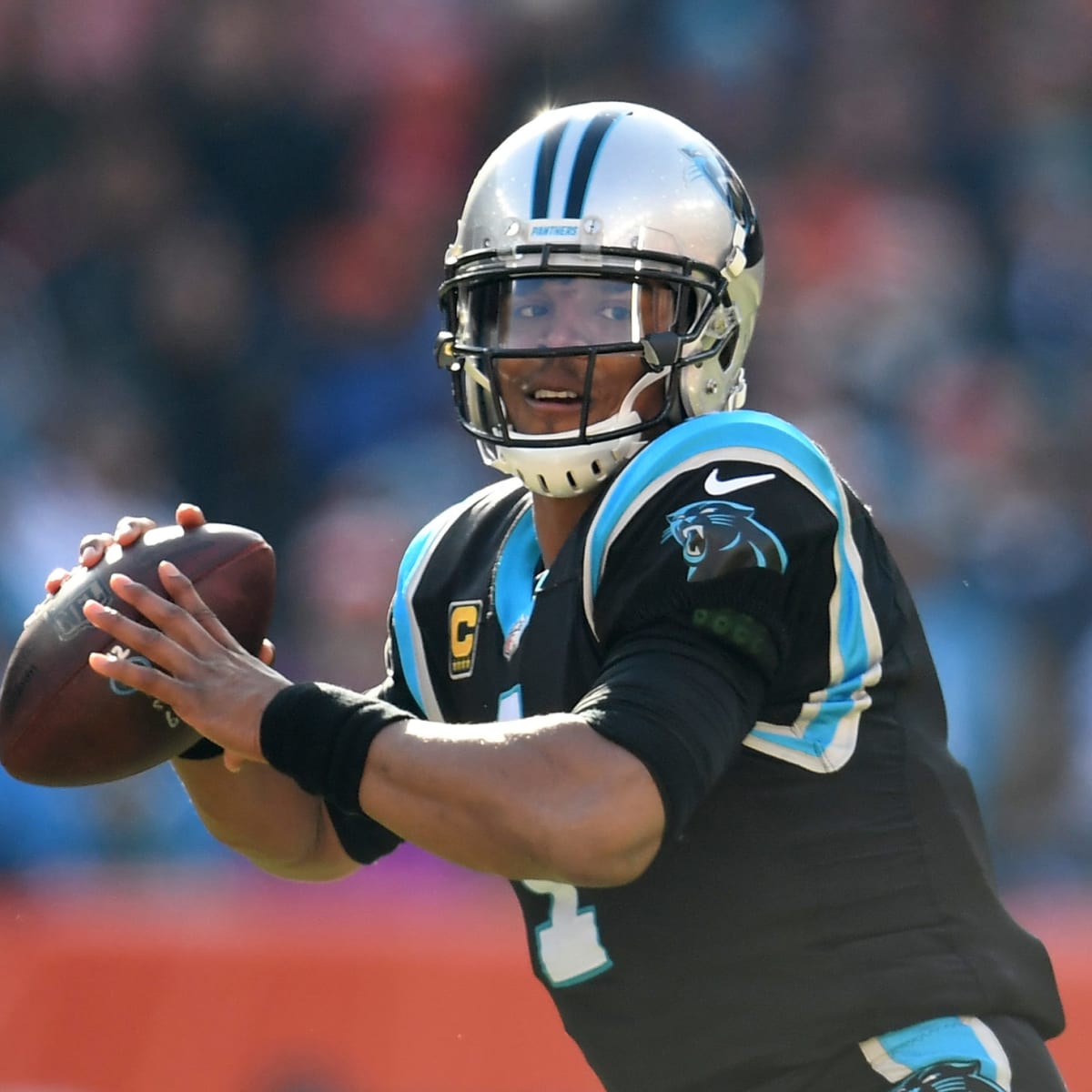 Carolina Panthers' Cam Newton (1) looks for an open receiver