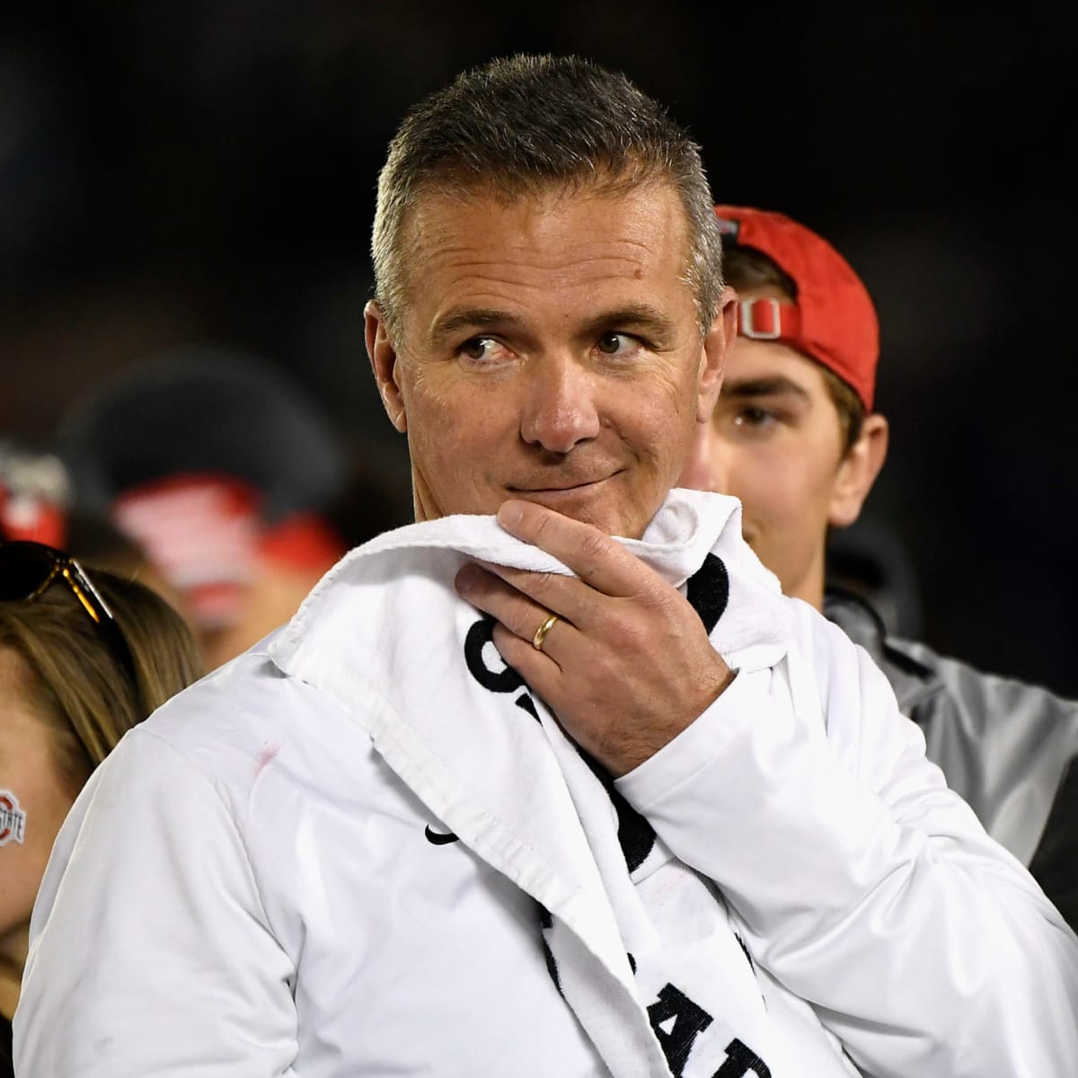 Indianapolis, USA. 08th Dec, 2019. Ohio State Buckeye's Chase Young (2)  salutes former Buckeye coach Urban Meyer after defeating the Wisconsin  Badgers for the Big Ten Championship Saturday, December 7, 2019 in