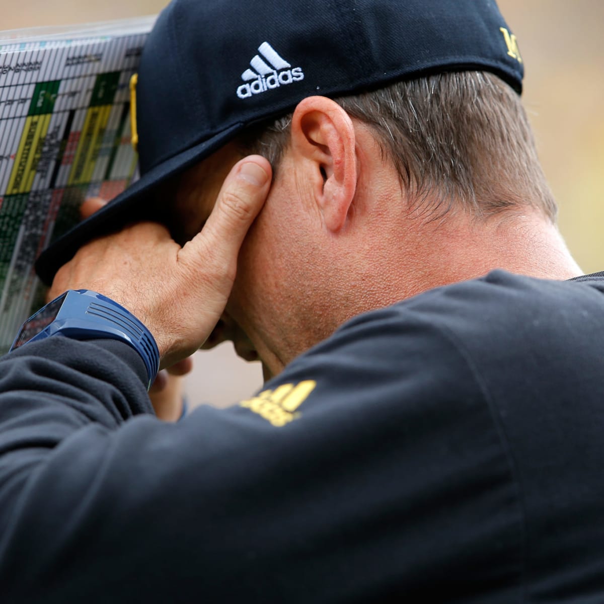 Does Michigan coach Jim Harbaugh have a Harambe photo in his office?